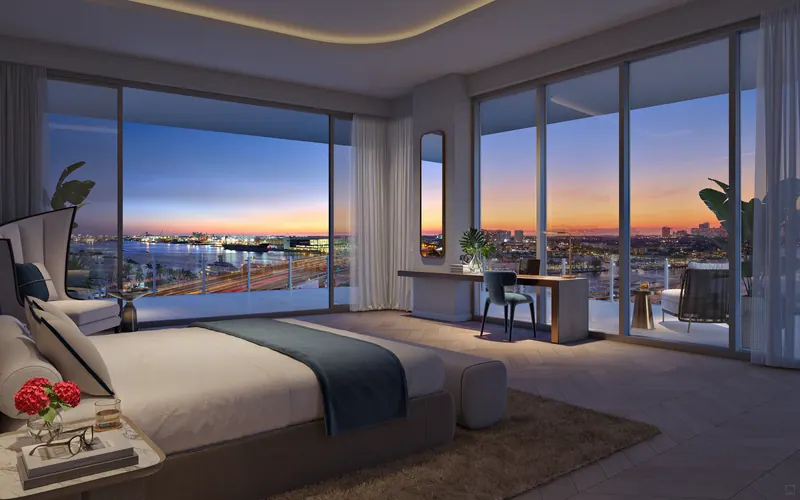 Penthouse primary suite with sunset views